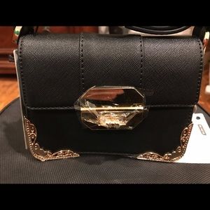 Mini bag in black. New with tag